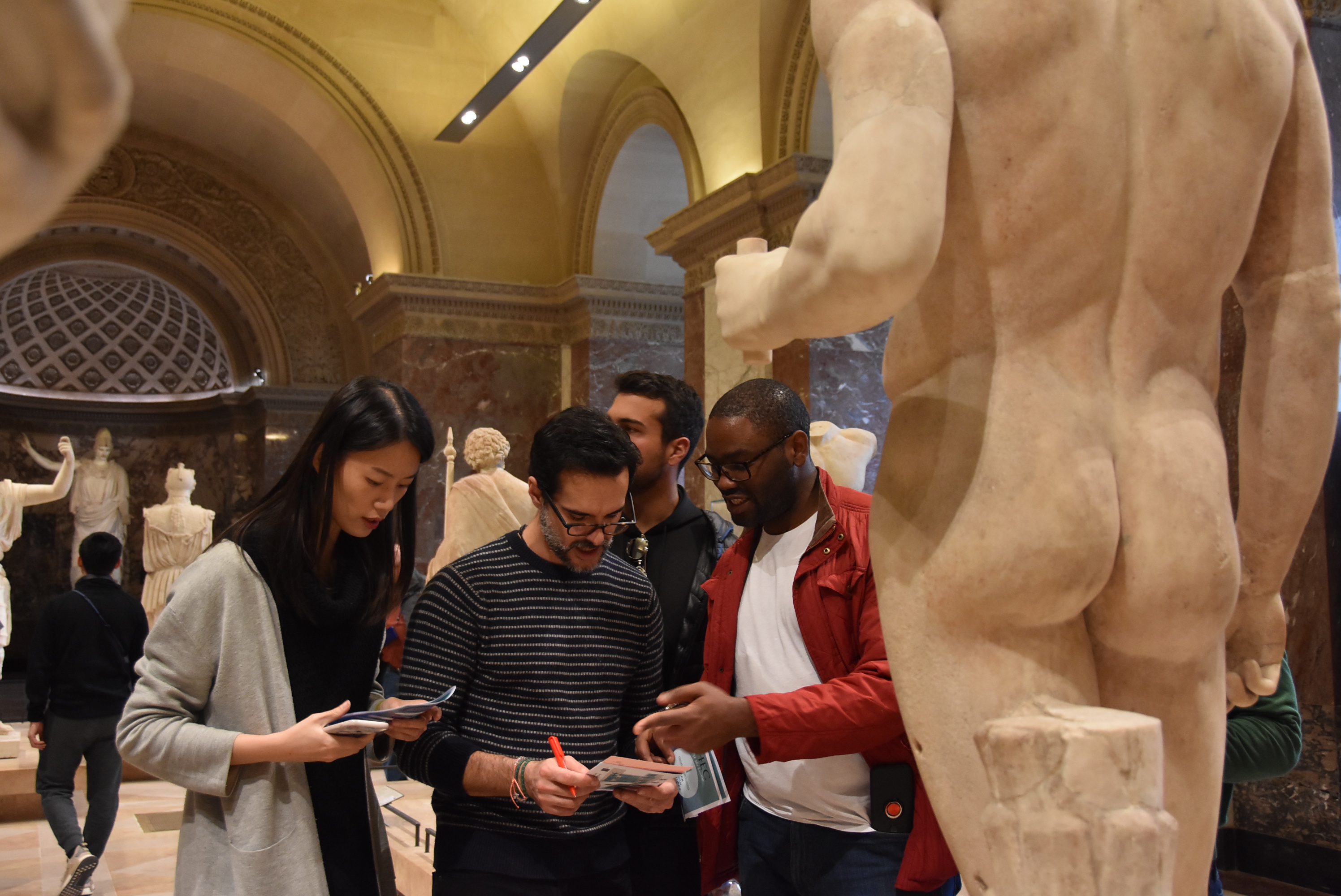 HEC Paris MBA students on a scavenger hunt at the Louvre